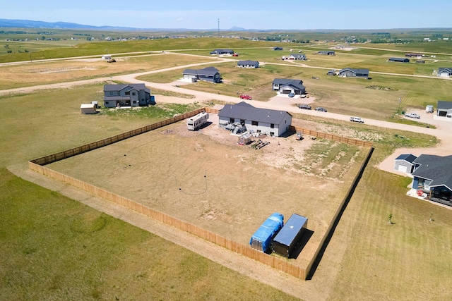 birds eye view of property with a rural view