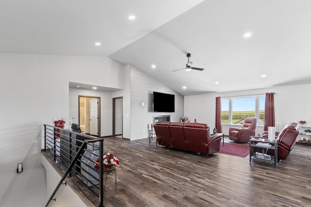 living room with dark wood-style floors, vaulted ceiling, a ceiling fan, and recessed lighting