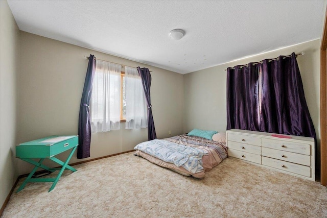 bedroom with carpet flooring and a textured ceiling