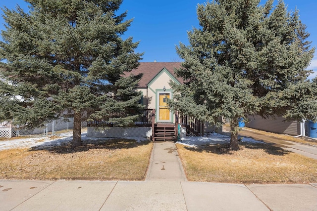 obstructed view of property with fence