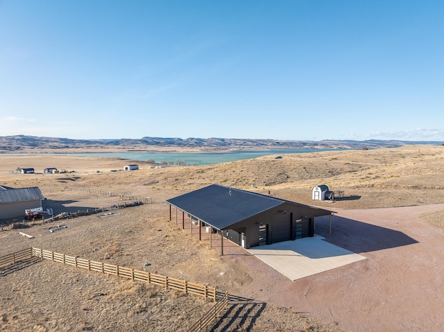 birds eye view of property with a mountain view