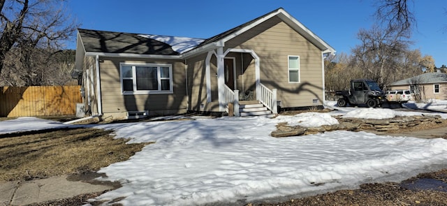 view of front of house featuring fence