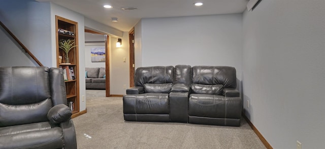 cinema room featuring carpet floors, built in shelves, recessed lighting, and baseboards