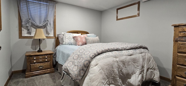 bedroom with carpet and baseboards