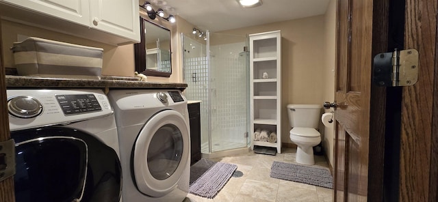 laundry area with light tile patterned flooring and independent washer and dryer