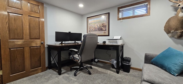 carpeted home office with baseboards