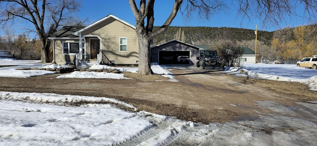 view of front of home with an outbuilding and a garage