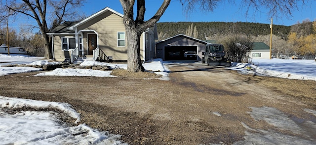 view of front of house featuring an outbuilding and a detached garage