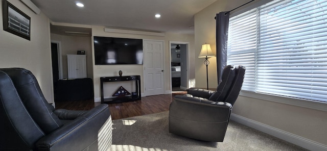 living area with recessed lighting and baseboards