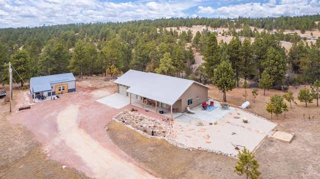 drone / aerial view with a forest view