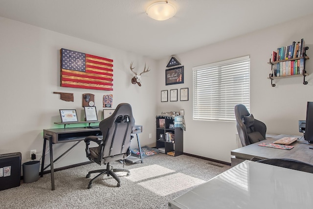 home office featuring carpet and baseboards