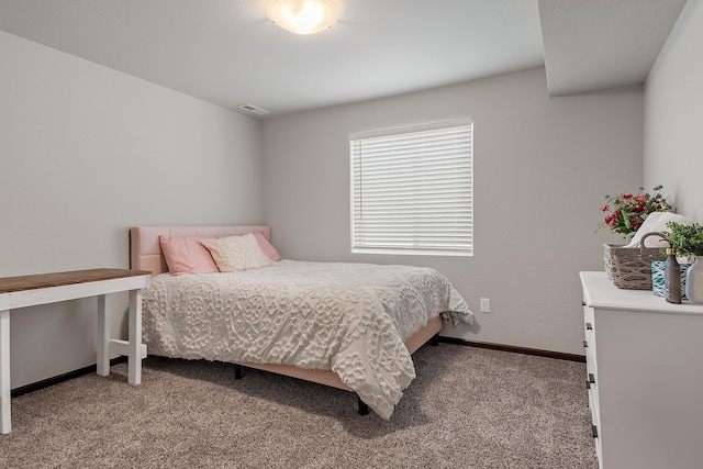 bedroom with carpet flooring, visible vents, and baseboards