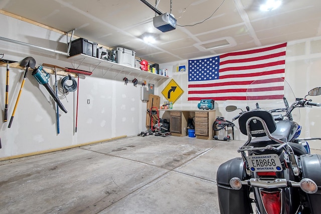 garage with electric panel and a garage door opener