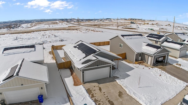 snowy aerial view featuring a residential view