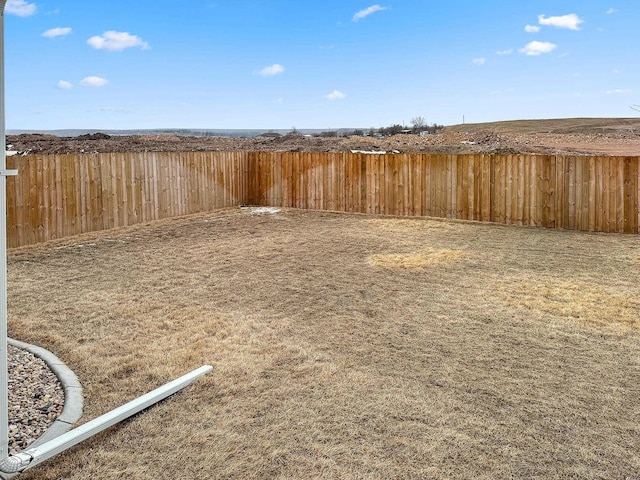 view of yard with a fenced backyard