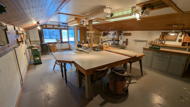 dining space with lofted ceiling, wood ceiling, and a workshop area