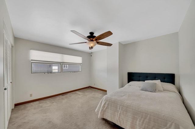 bedroom featuring a ceiling fan, visible vents, carpet, and baseboards