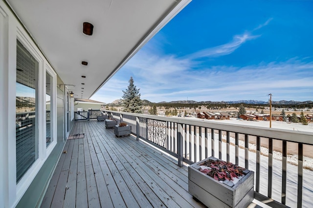 wooden deck with a mountain view