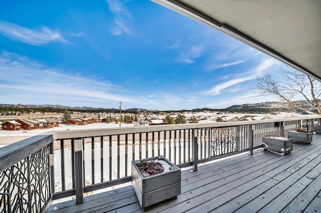 wooden terrace with a mountain view and a residential view