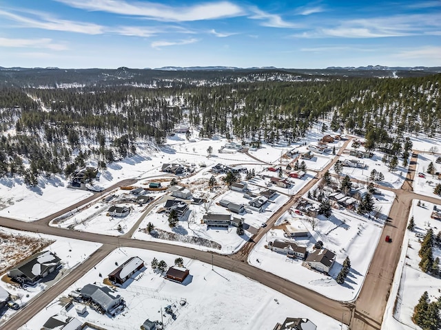 snowy aerial view with a mountain view