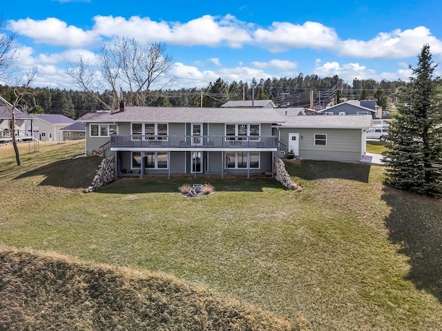 back of property featuring a chimney, a wooden deck, and a lawn