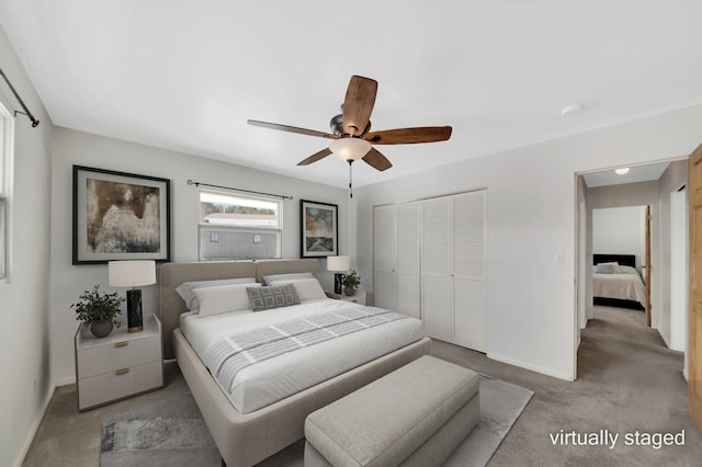 bedroom with a closet, baseboards, carpet, and a ceiling fan