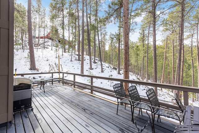 snow covered deck with grilling area