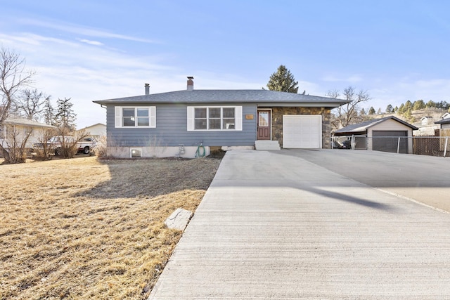 view of front of home with a garage and a chimney