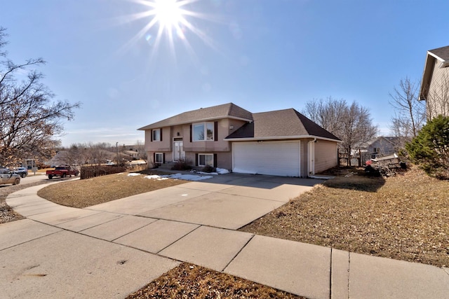 view of front of property with a garage, brick siding, driveway, and a shingled roof