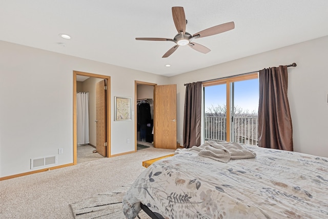 3418 Gray Fox Ct, Rapid City, SD 57701 - bedroom with visible vents, baseboards, a spacious closet, light carpet, and access to outside