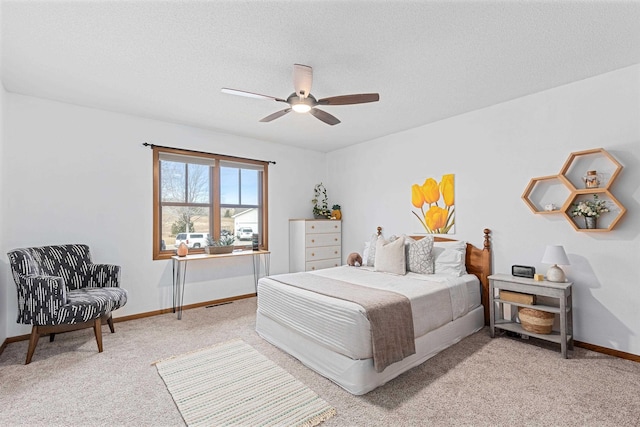 3418 Gray Fox Ct, Rapid City, SD 57701 - bedroom featuring ceiling fan, light carpet, baseboards, and a textured ceiling