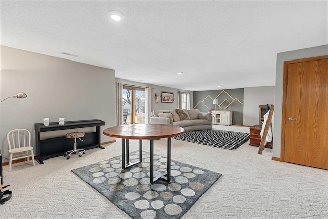 3418 Gray Fox Ct, Rapid City, SD 57701 - carpeted living area with visible vents, recessed lighting, and a textured ceiling
