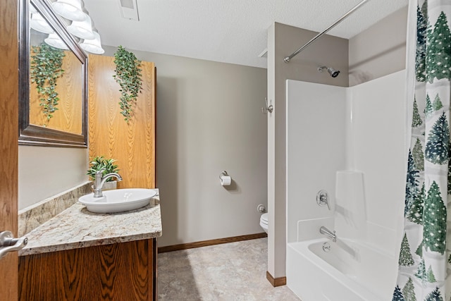 3418 Gray Fox Ct, Rapid City, SD 57701 - bathroom featuring baseboards, toilet, shower / bath combo with shower curtain, vanity, and a textured ceiling