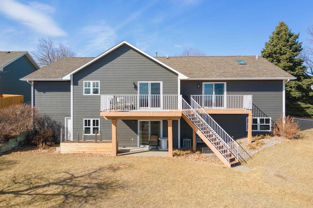 3418 Gray Fox Ct, Rapid City, SD 57701 - rear view of house with stairway, a patio, a wooden deck, and a shingled roof