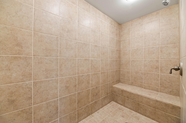 full bathroom with tiled shower