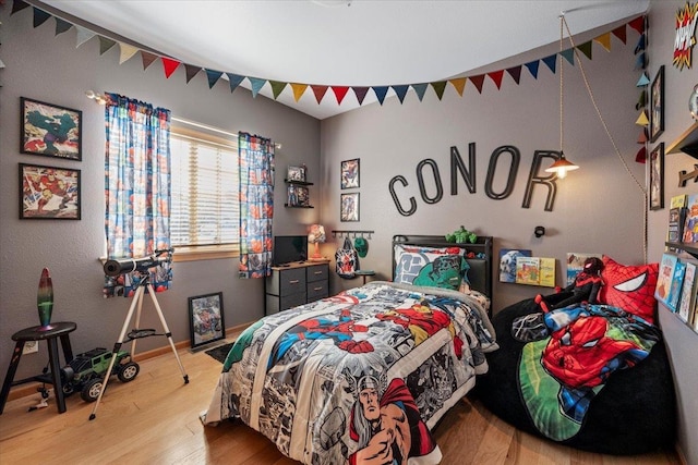 bedroom featuring wood finished floors