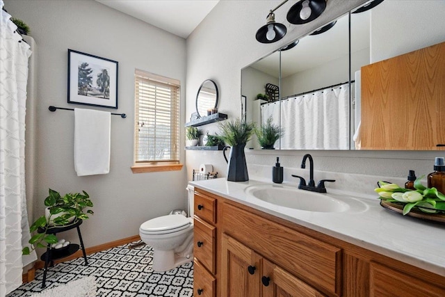 full bathroom with vanity, baseboards, curtained shower, tile patterned floors, and toilet