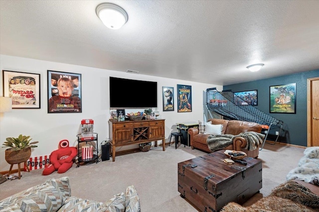 carpeted living area with visible vents and a textured ceiling