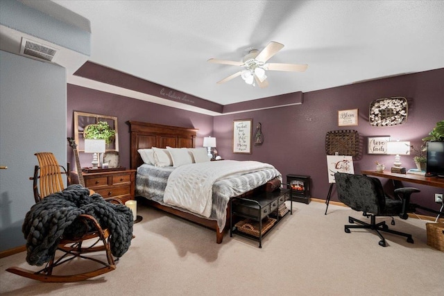 bedroom with carpet flooring, baseboards, visible vents, and ceiling fan