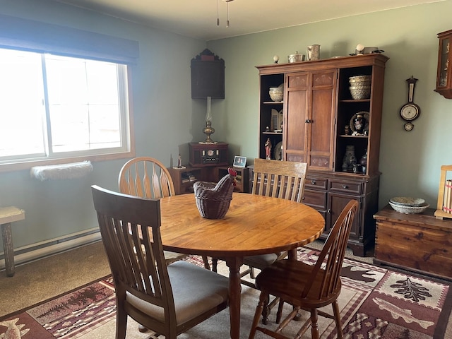 dining room featuring baseboard heating