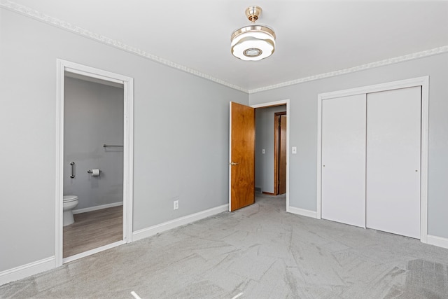 4320 Circle Dr, Rapid City, SD 57702 - unfurnished bedroom with a closet, baseboards, and carpet flooring