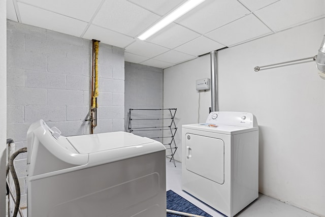 4320 Circle Dr, Rapid City, SD 57702 - clothes washing area featuring laundry area, concrete block wall, and washer and clothes dryer