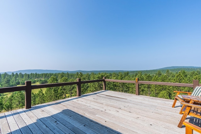 deck featuring a forest view