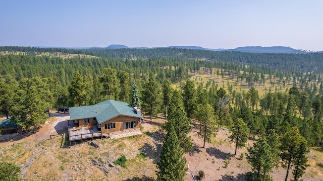 aerial view featuring a mountain view and a forest view