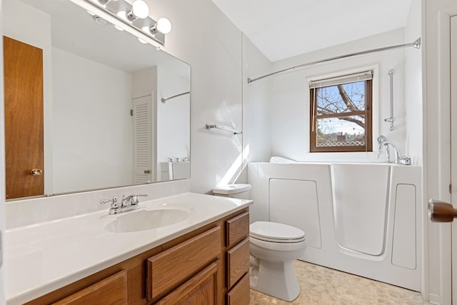 full bathroom featuring vanity, toilet, and a bath