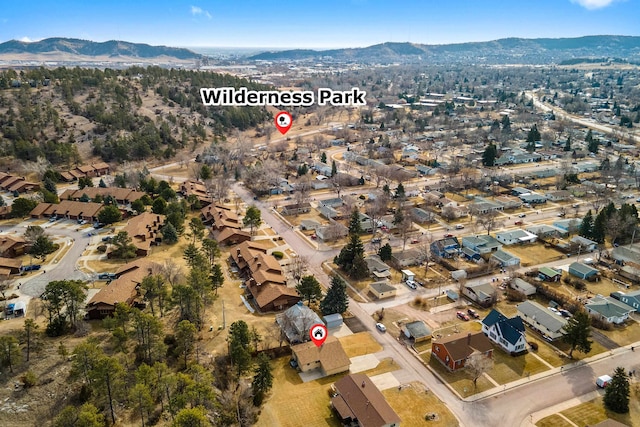 drone / aerial view with a residential view and a mountain view