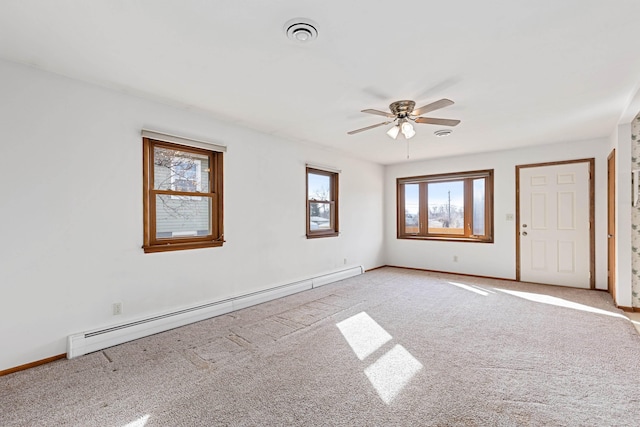 unfurnished room with a ceiling fan, baseboards, visible vents, a baseboard radiator, and light carpet