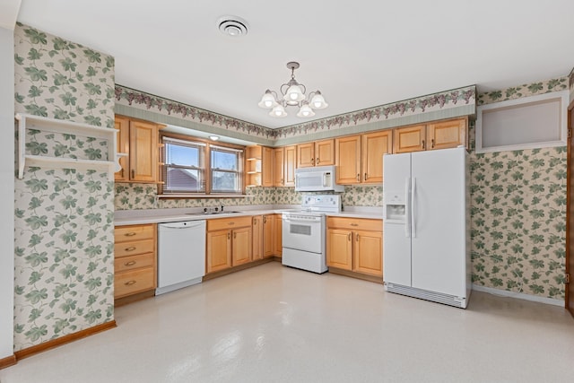 kitchen featuring white appliances, visible vents, wallpapered walls, a sink, and light countertops