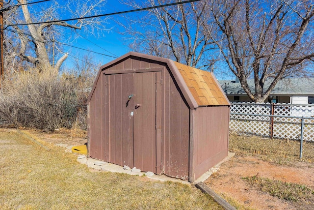 view of shed with fence