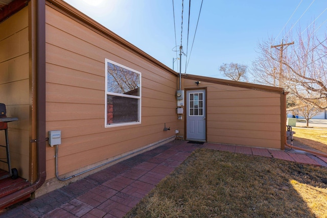 rear view of property featuring a yard